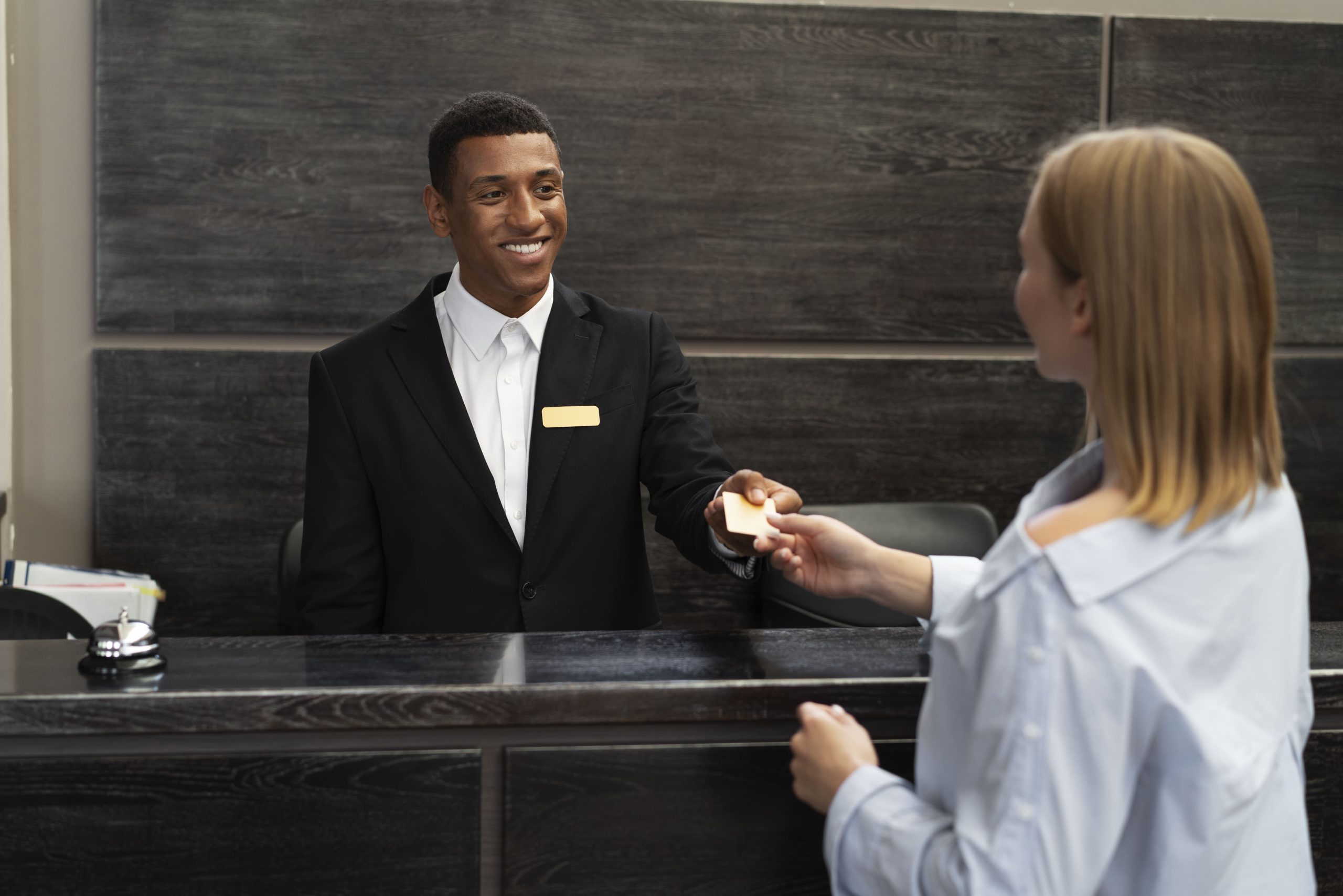 receptionist-elegant-suit-work-hours-with-customer-min